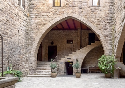 a stone building with a staircase leading up to it