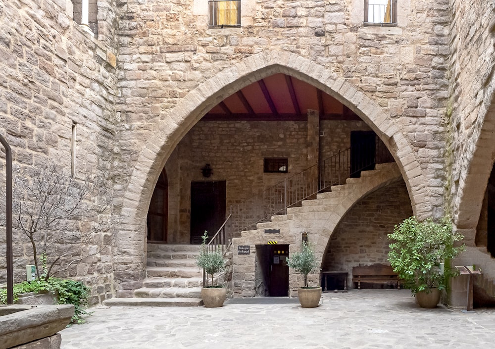 a stone building with a staircase leading up to it