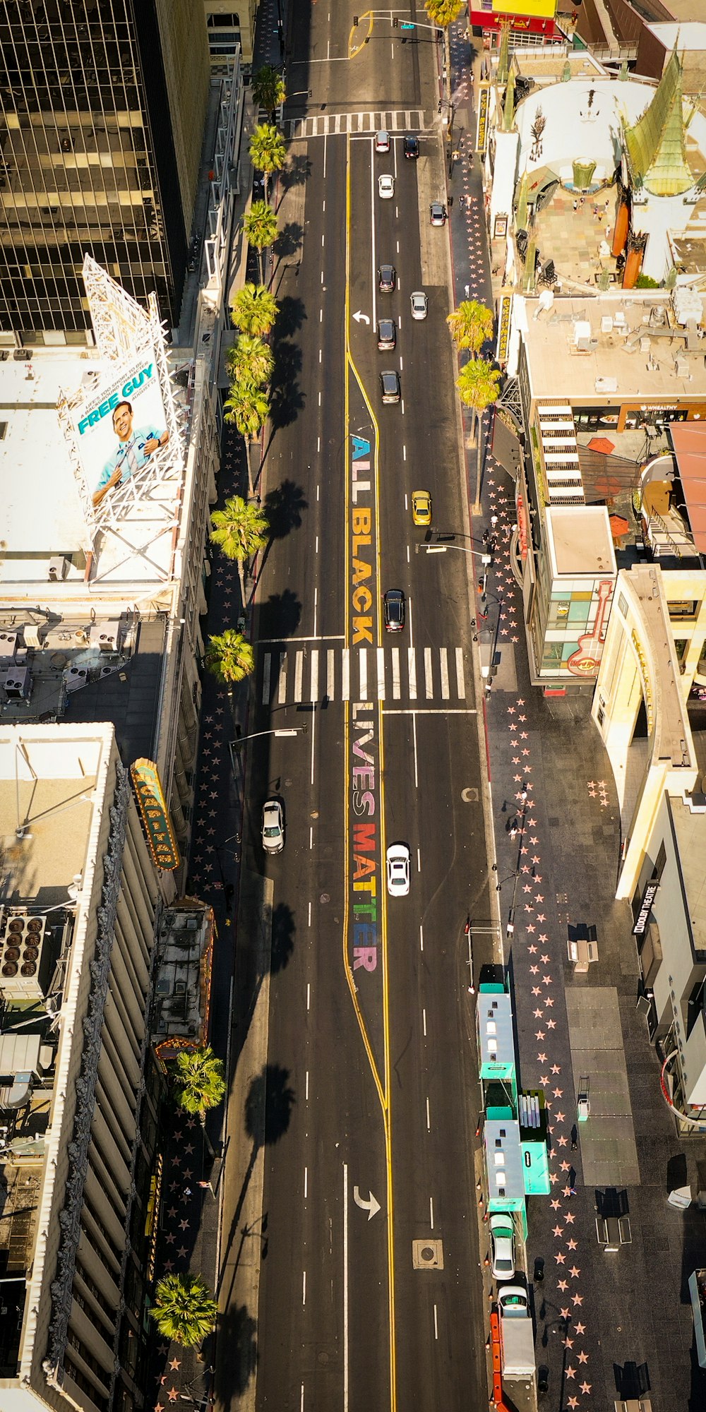 an aerial view of a city street with cars and trucks