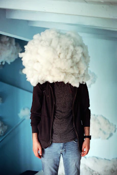 a man with a cloud over his head