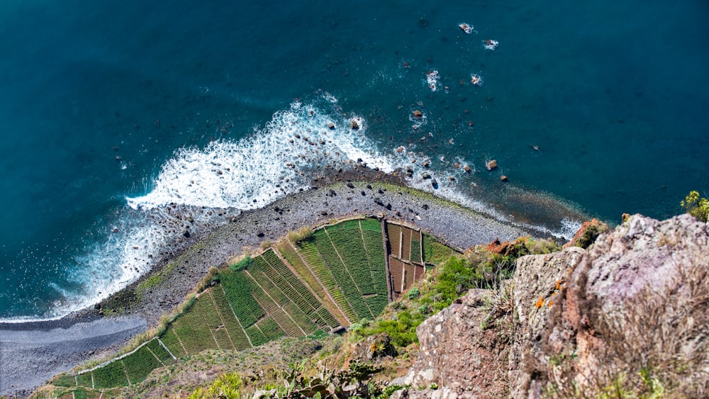 a bird's eye view of the ocean from a cliff