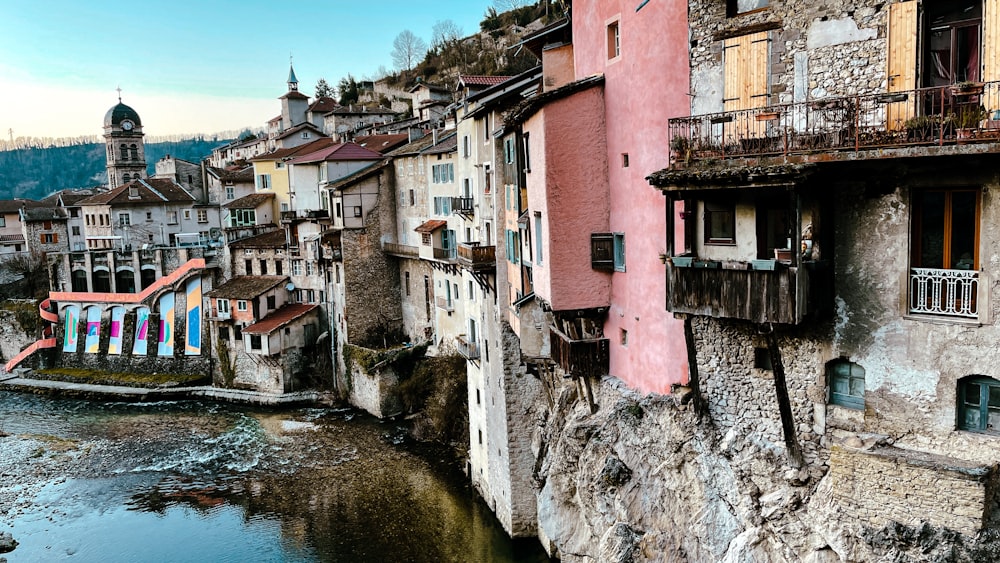 a river running through a city next to tall buildings