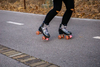 a person riding a skateboard down a street