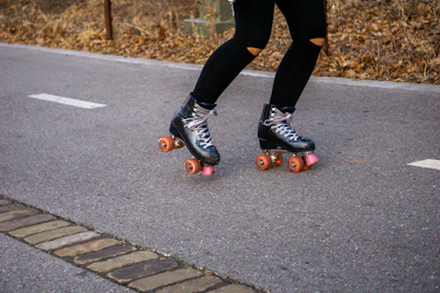 a person riding a skateboard down a street