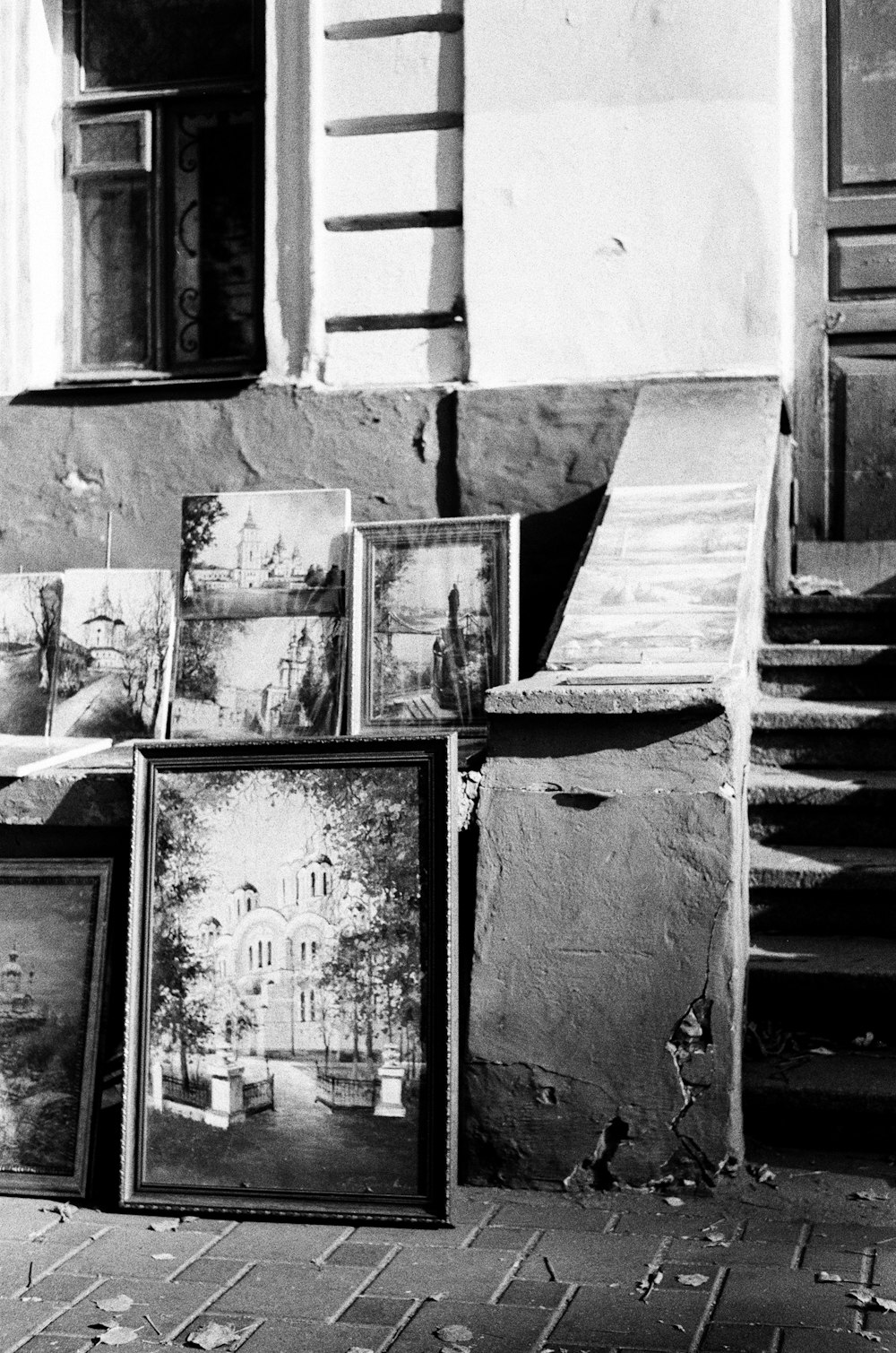a black and white photo of framed photographs