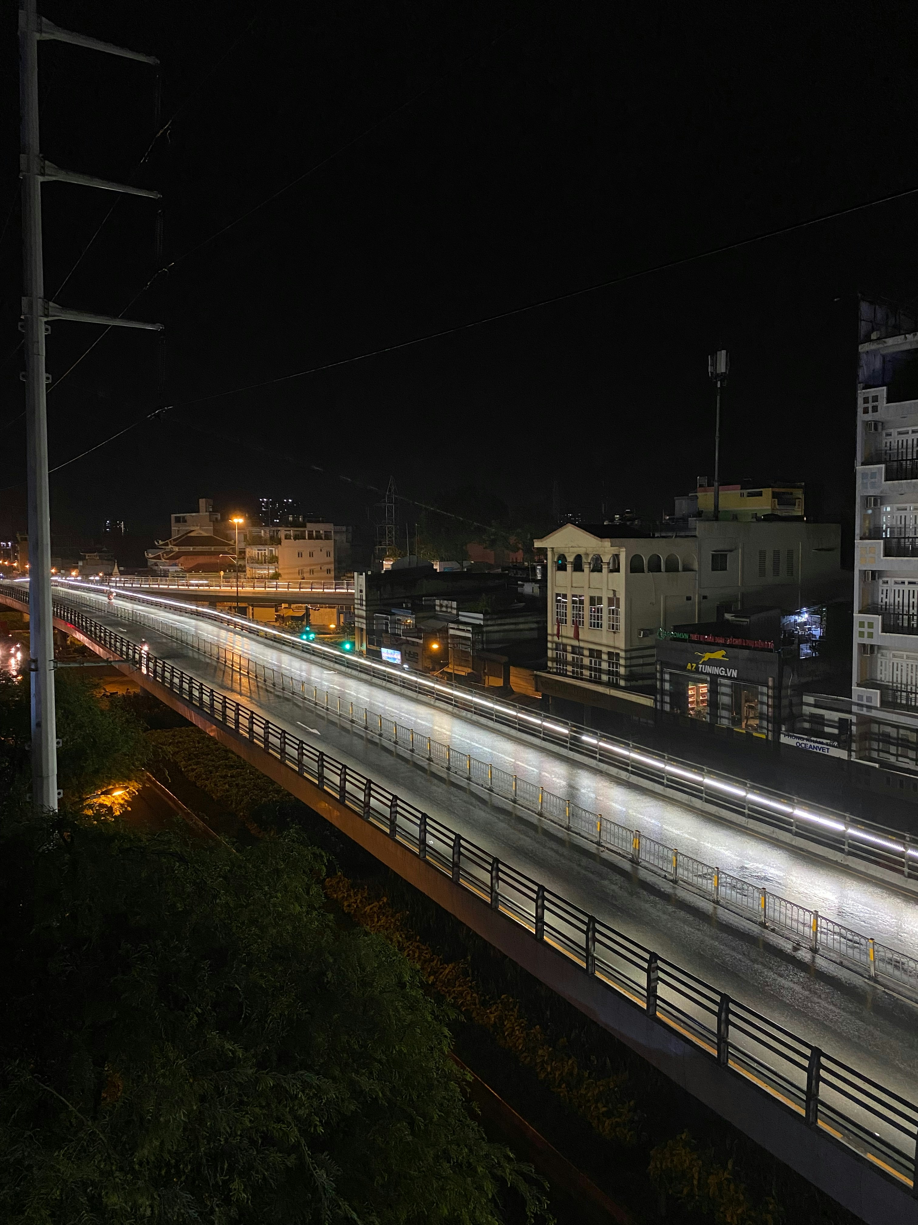 a train traveling down tracks next to tall buildings