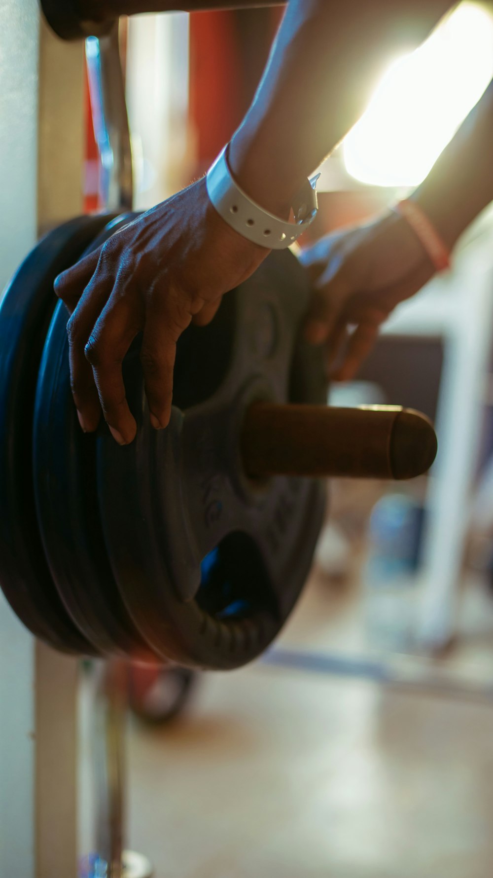 a person holding a barbell in a gym