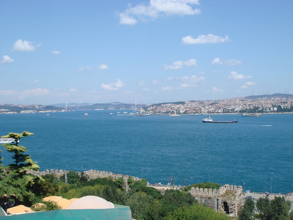 a large body of water with a boat in the distance