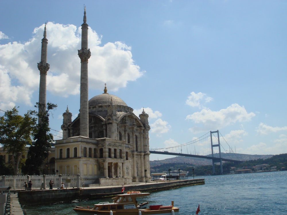 a large building sitting next to a body of water