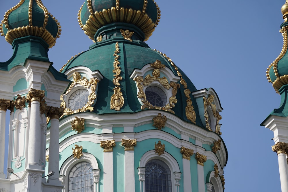 a blue and white building with a clock on it's side