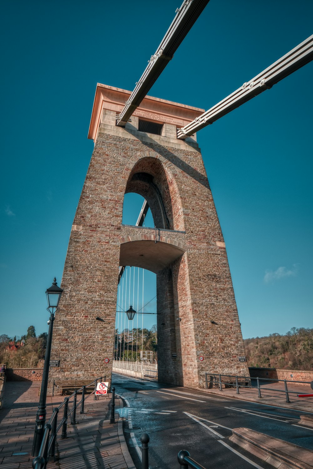 a very tall brick structure with a clock on it