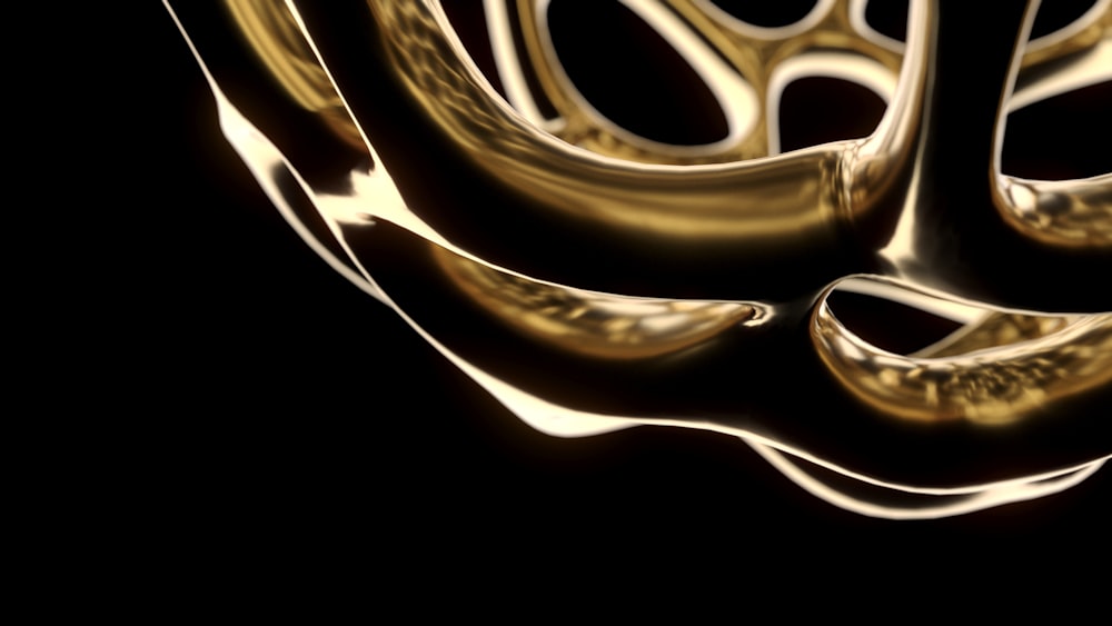 a black background with gold swirls and a black background