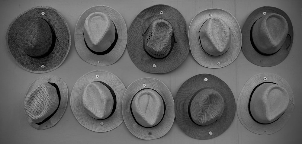 a group of hats hanging on a wall