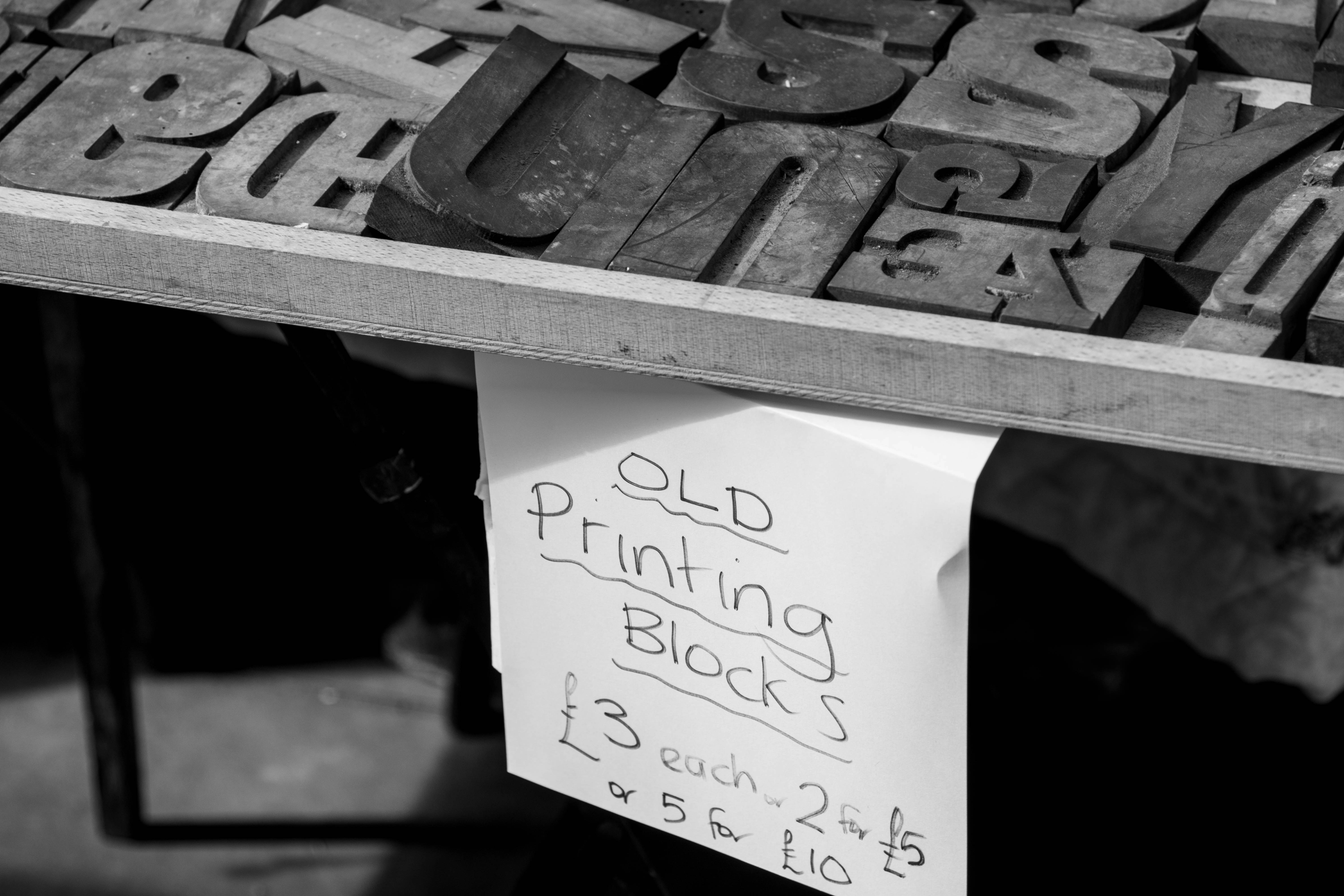 an old printing block with a note attached to it