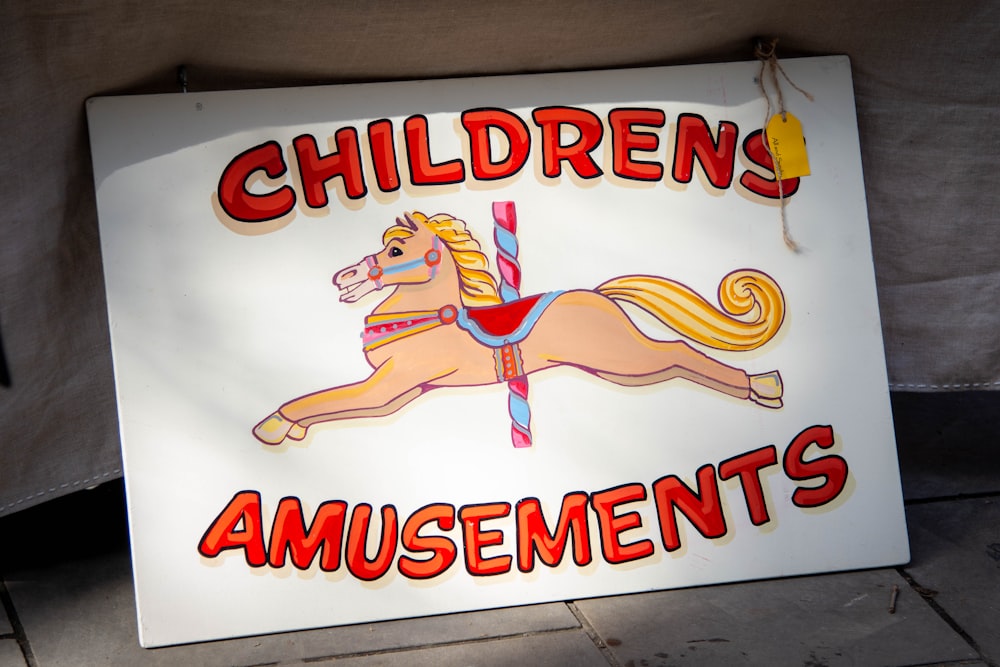 a sign that says children's amusements on it