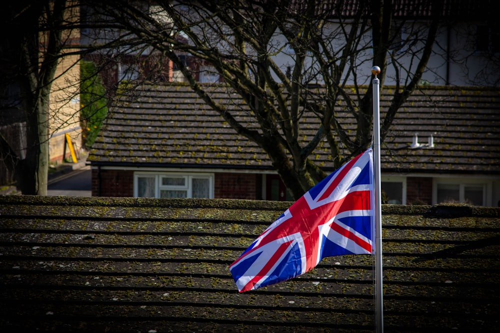 a british flag flying in front of a house