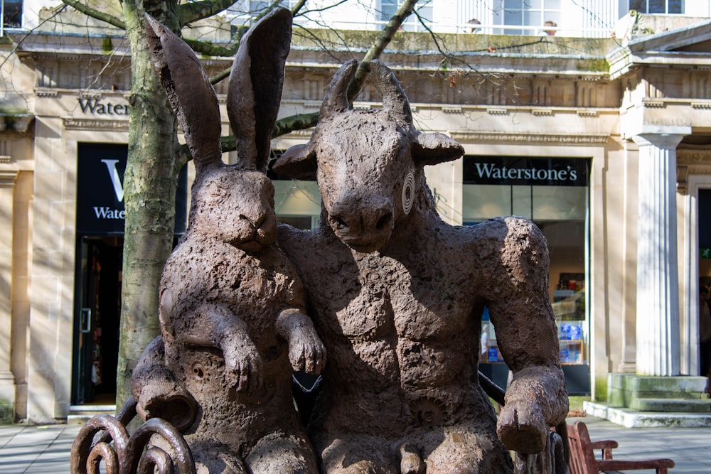a statue of two rabbits sitting next to each other