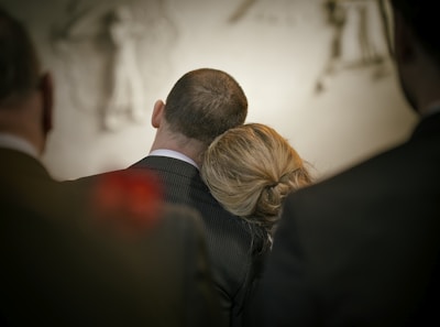 a man and a woman looking at the camera