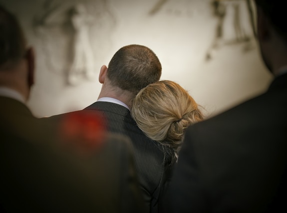 a man and a woman looking at the camera