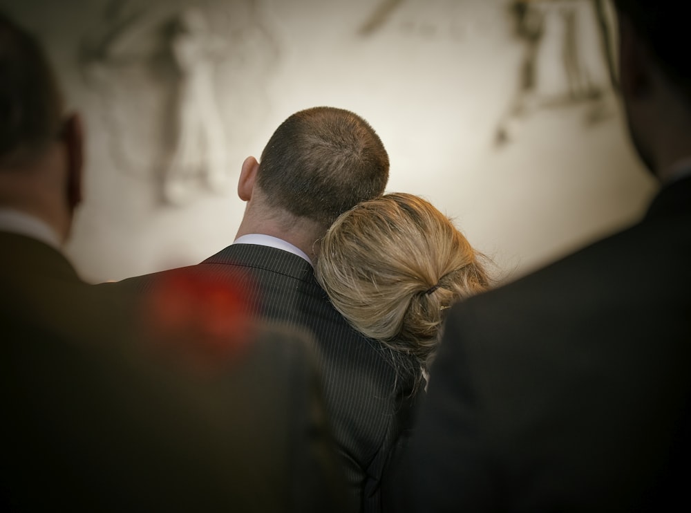 a man and a woman looking at the camera