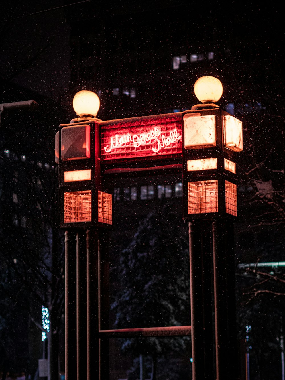 a couple of lights that are on top of a pole