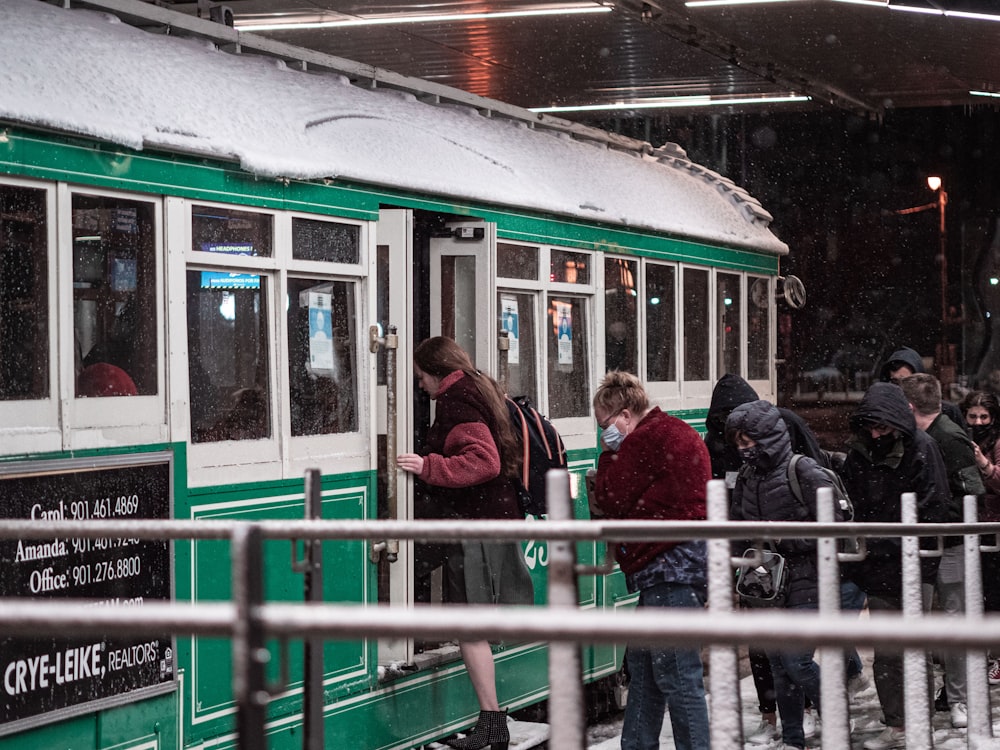 a group of people sitting at a train station