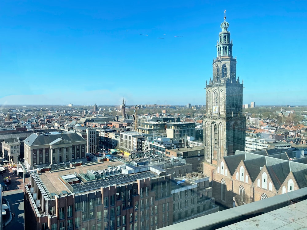 a large clock tower towering over a city