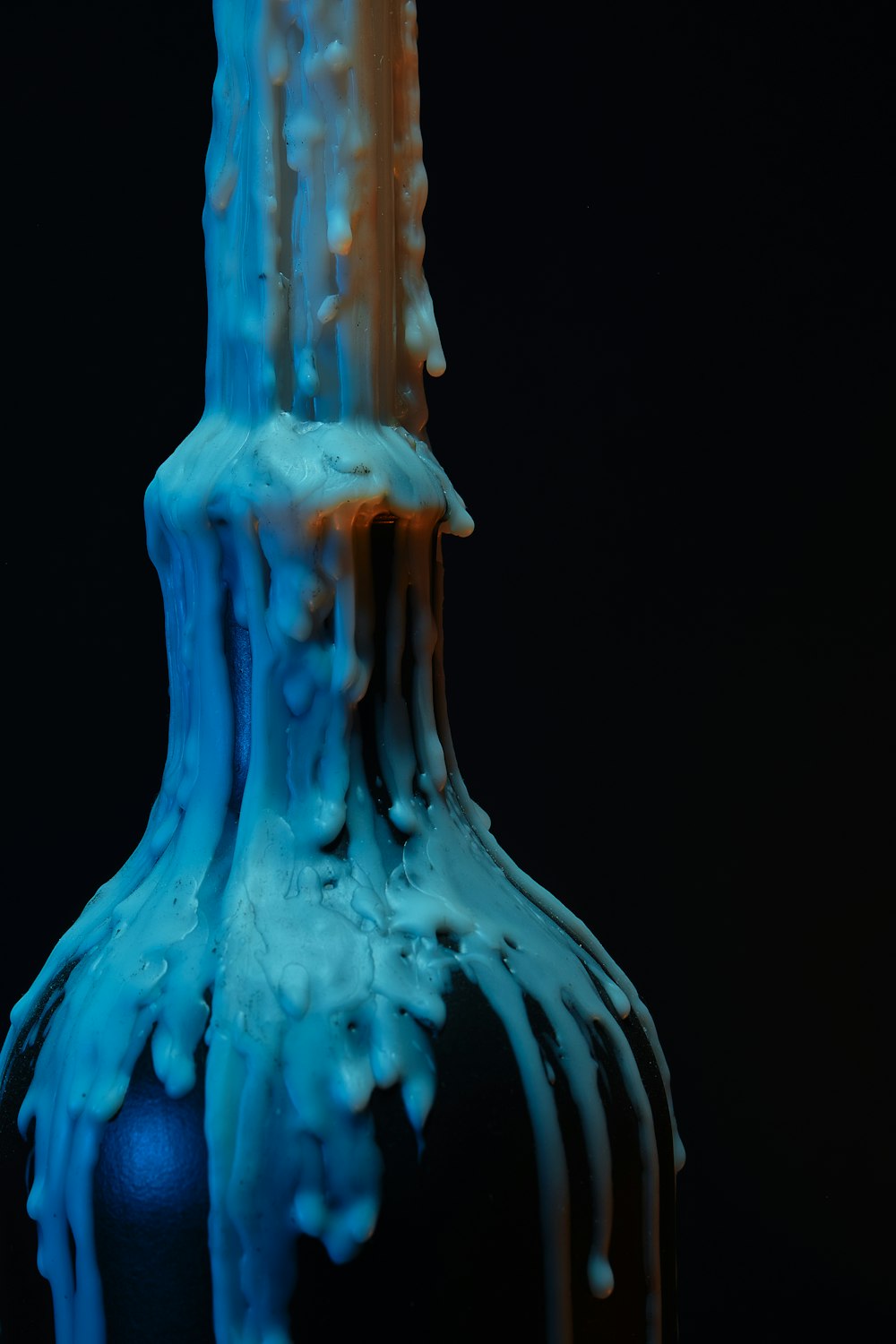 a blue and white vase sitting on top of a table