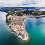 an aerial view of a city on the water