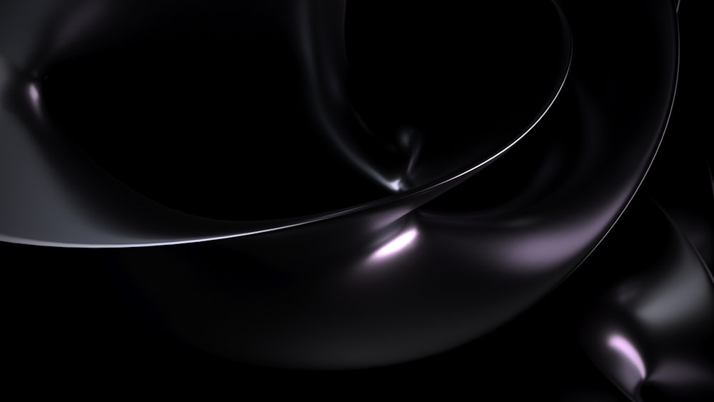 a black background with a white swirl in the middle
