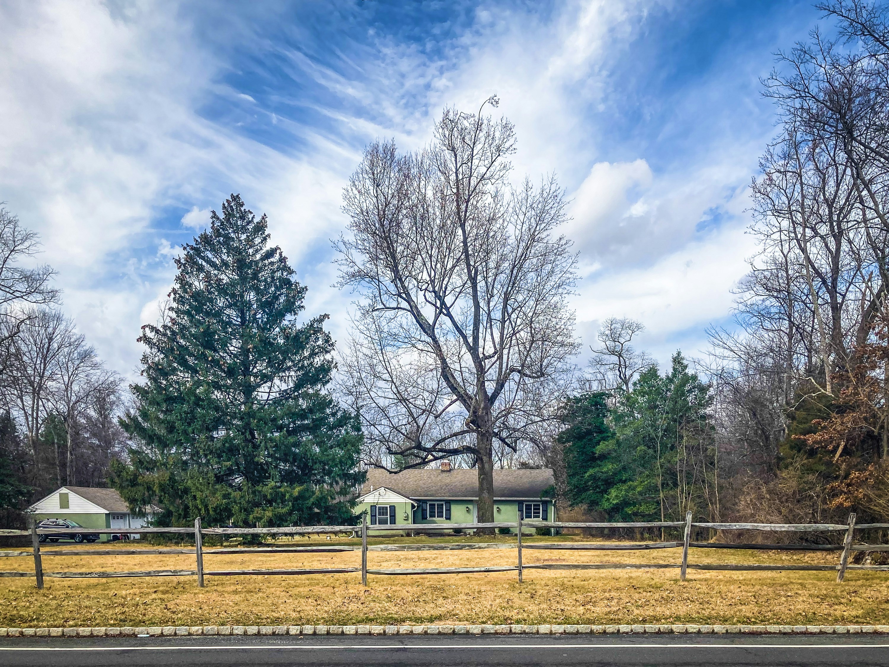a house with a fence in front of it