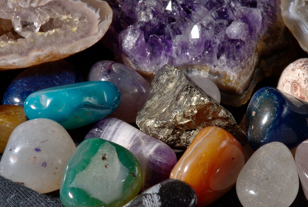 a pile of different colored rocks and crystals