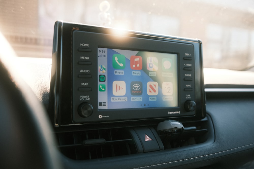 a car dashboard with an electronic device in it
