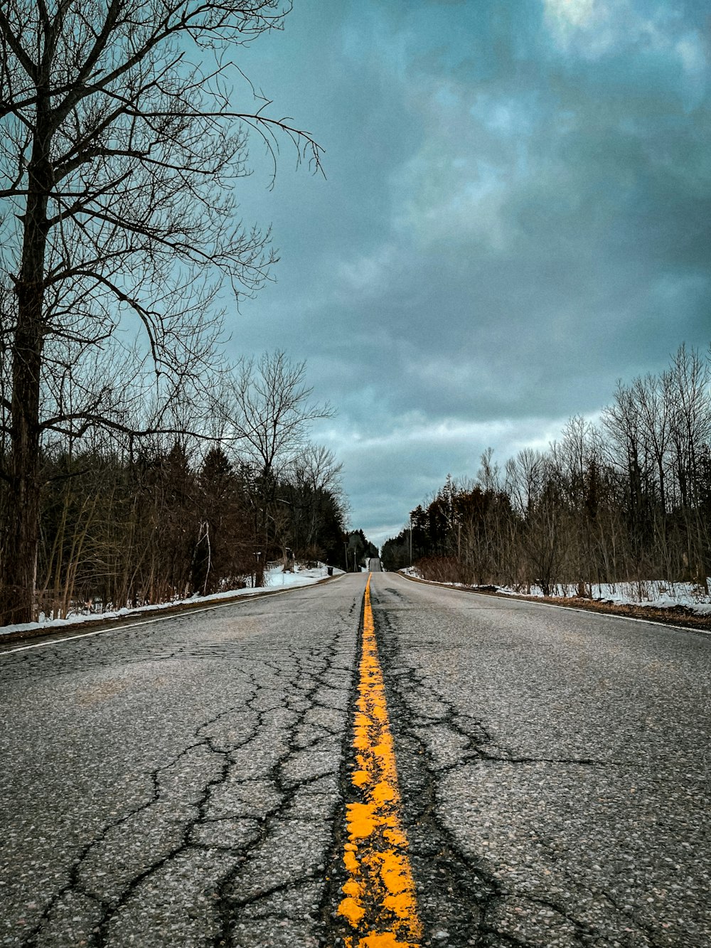 a road with a yellow line painted on it