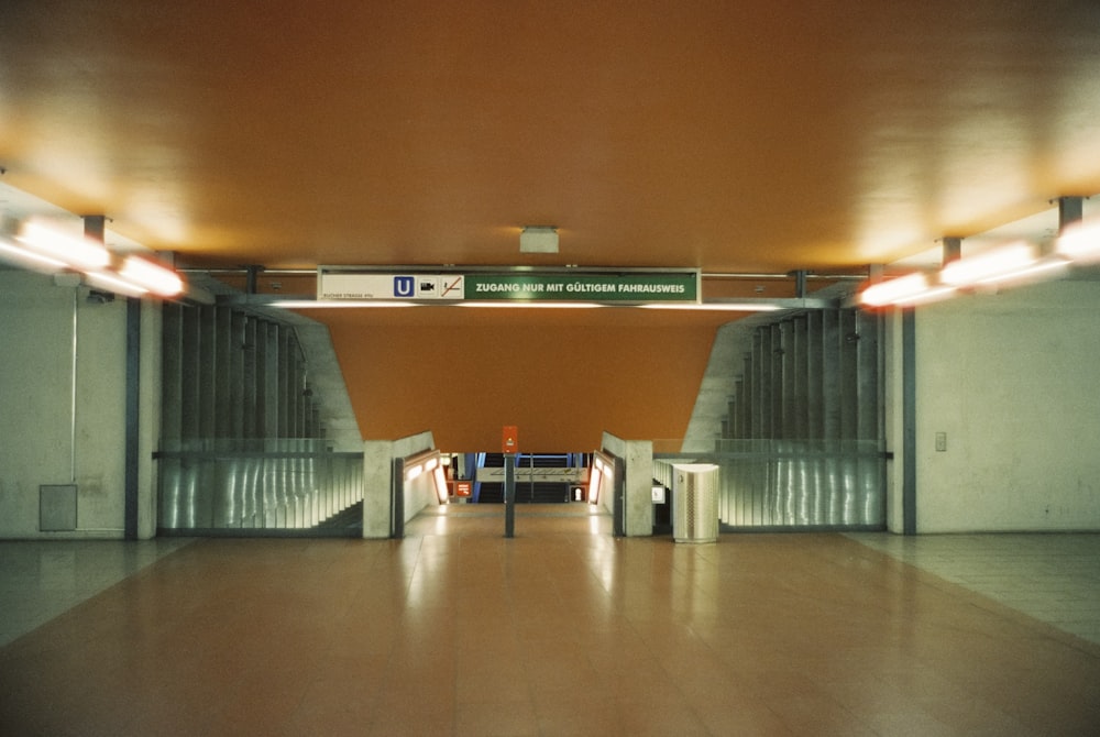 a long hallway with a sign on the wall