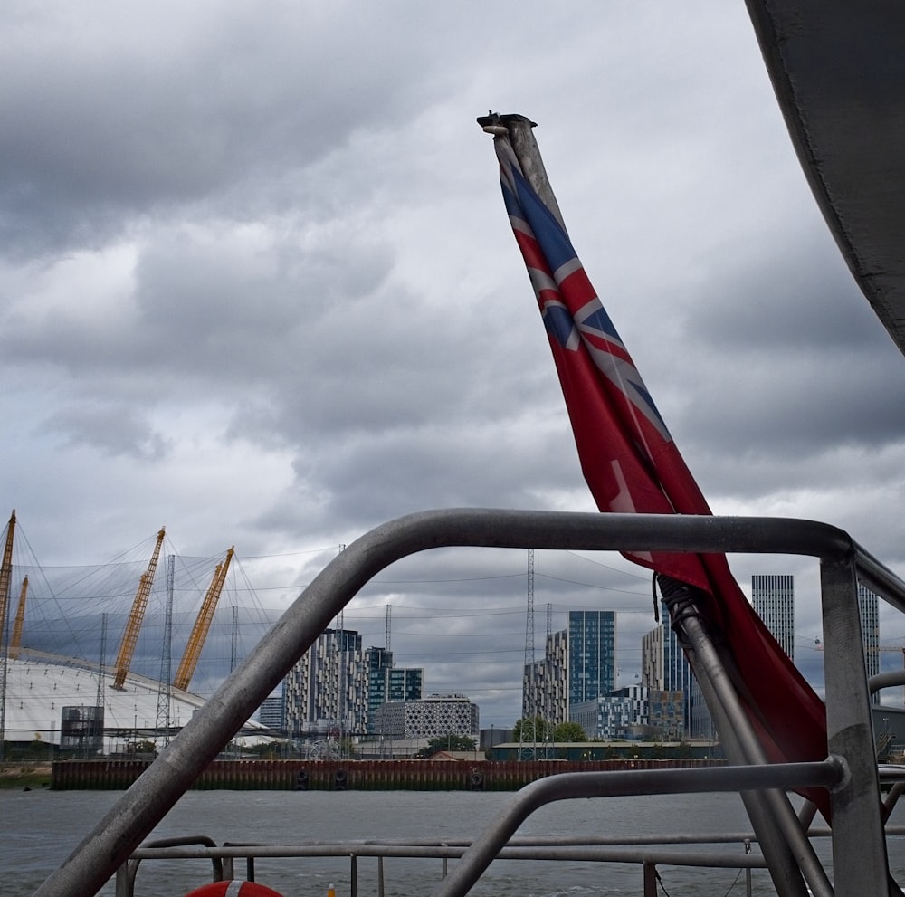 a flag on a boat in a body of water