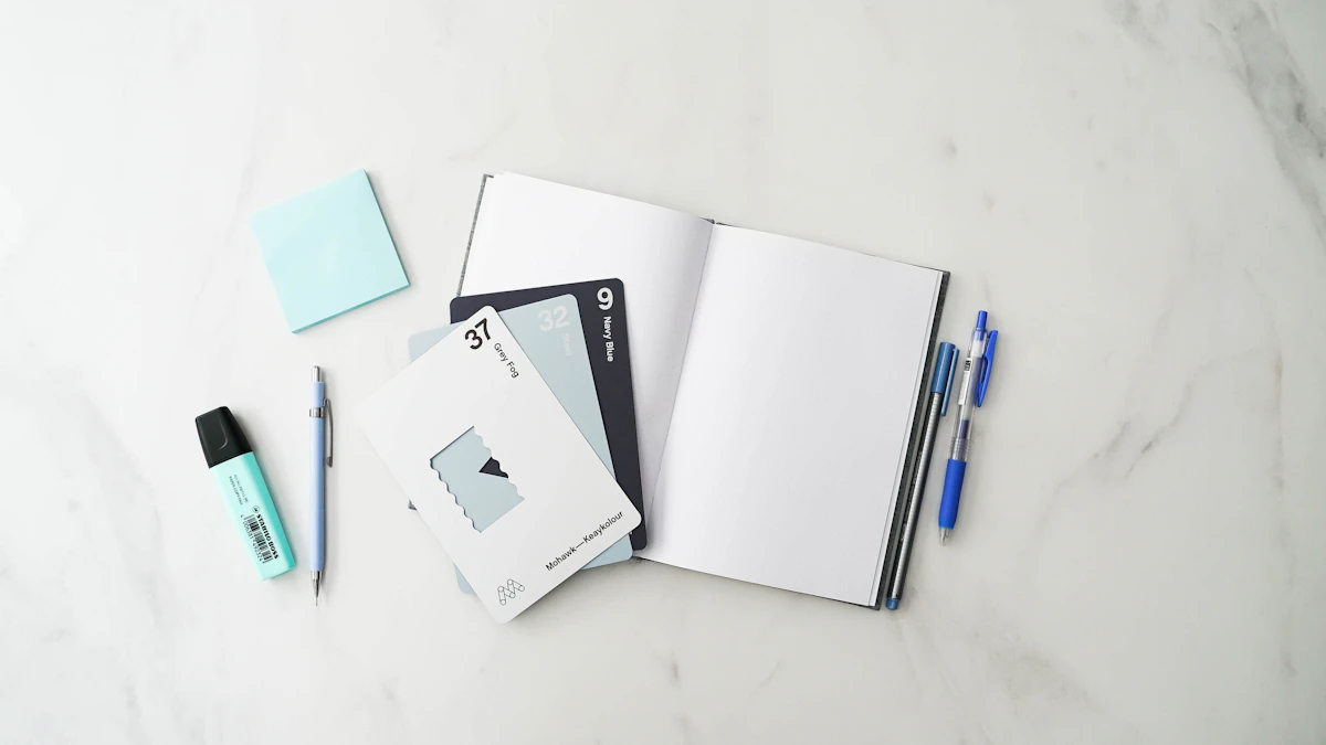 Notebook, pens and sticky notes spread on a marble desk