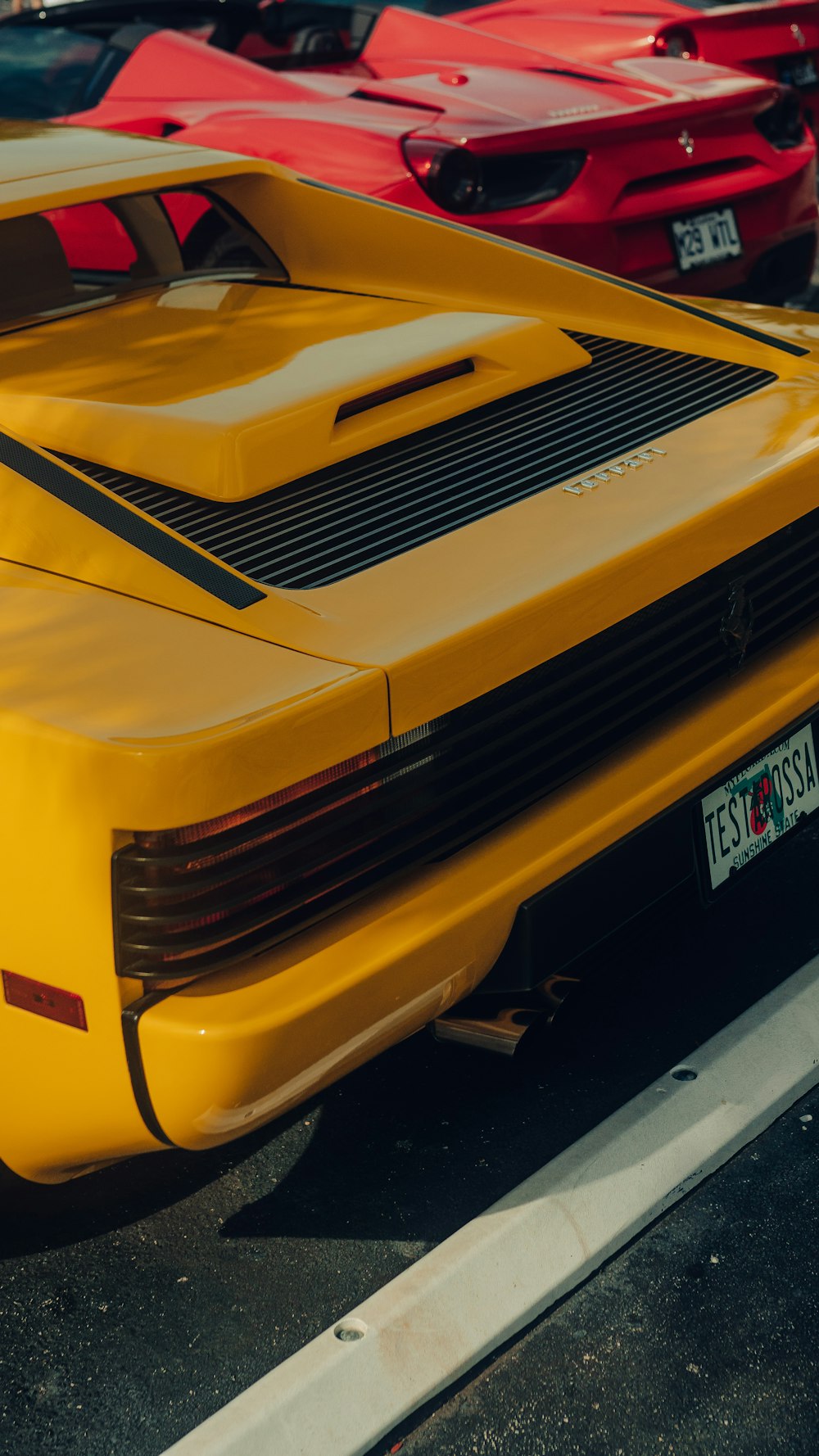 a yellow sports car parked in a parking lot