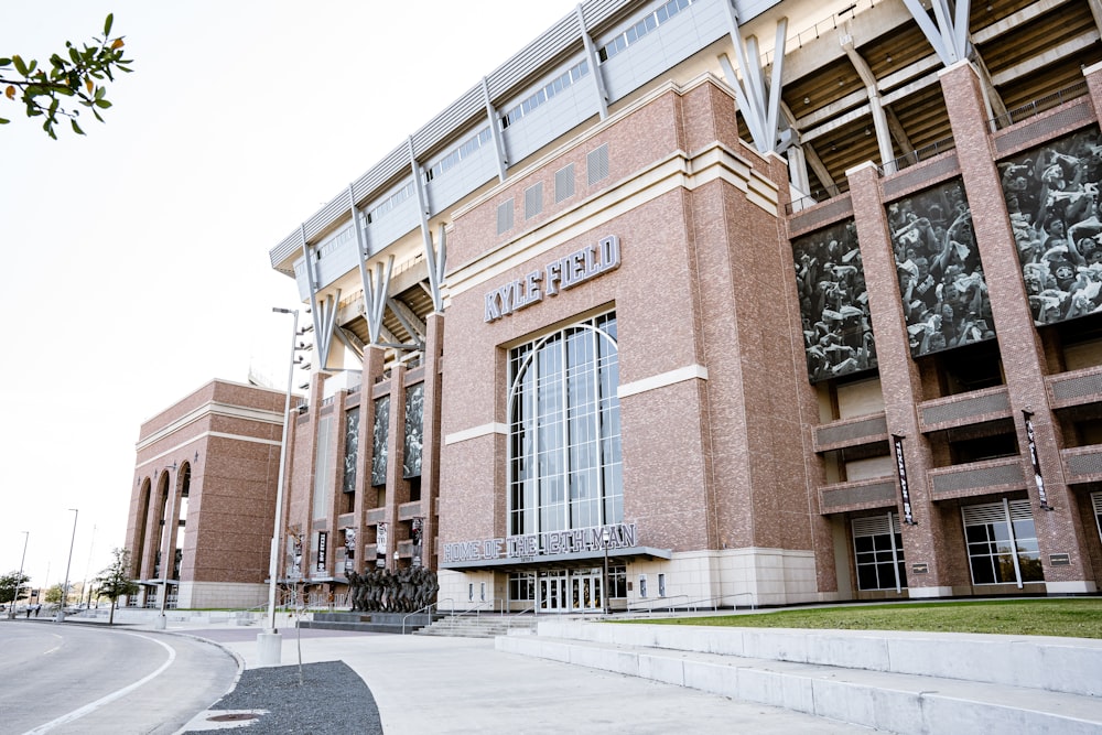 a large brick building with a clock on the front of it