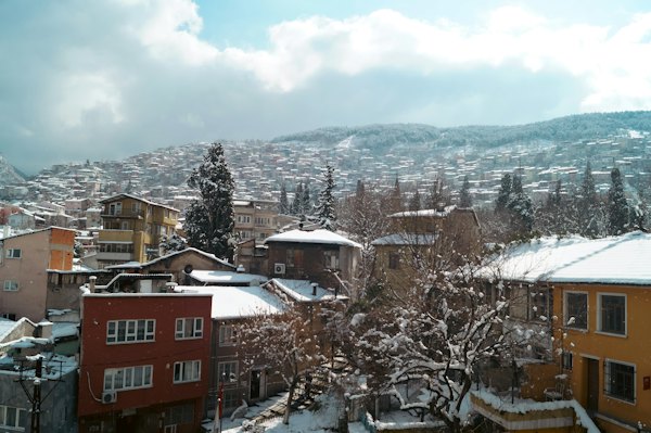 A view of a snow covered town from a window — Bursa, Turkey