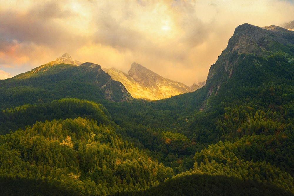 a view of a mountain range with a cloudy sky