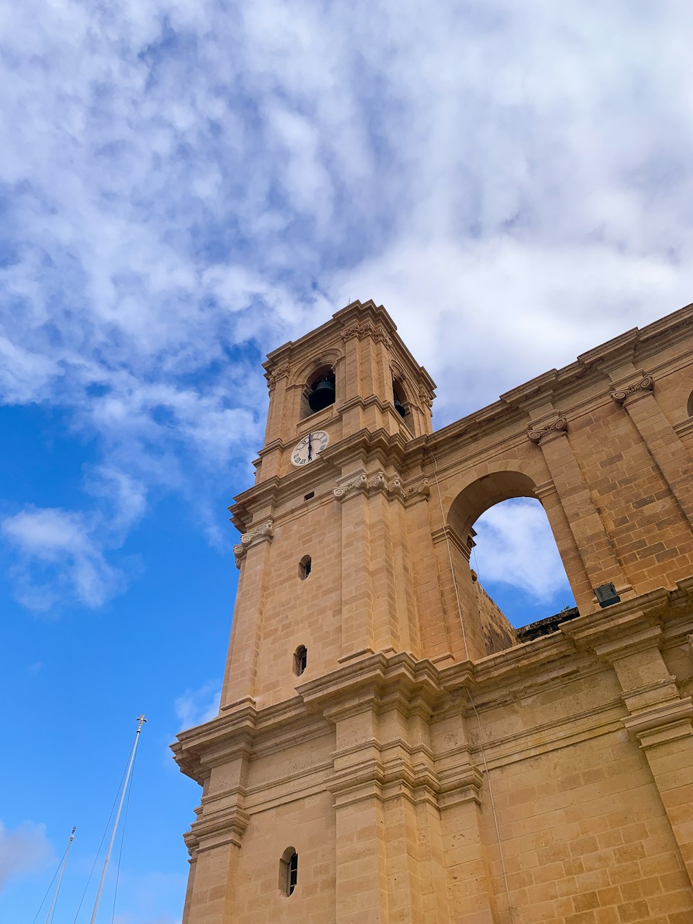 a tall tower with a clock on the top of it