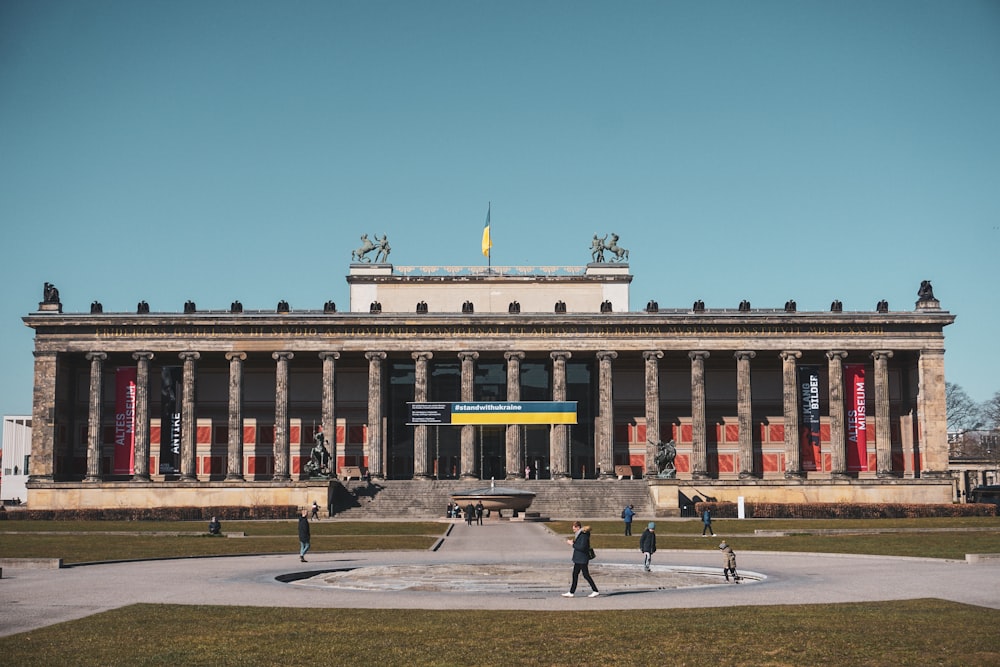 a large building with a fountain in front of it