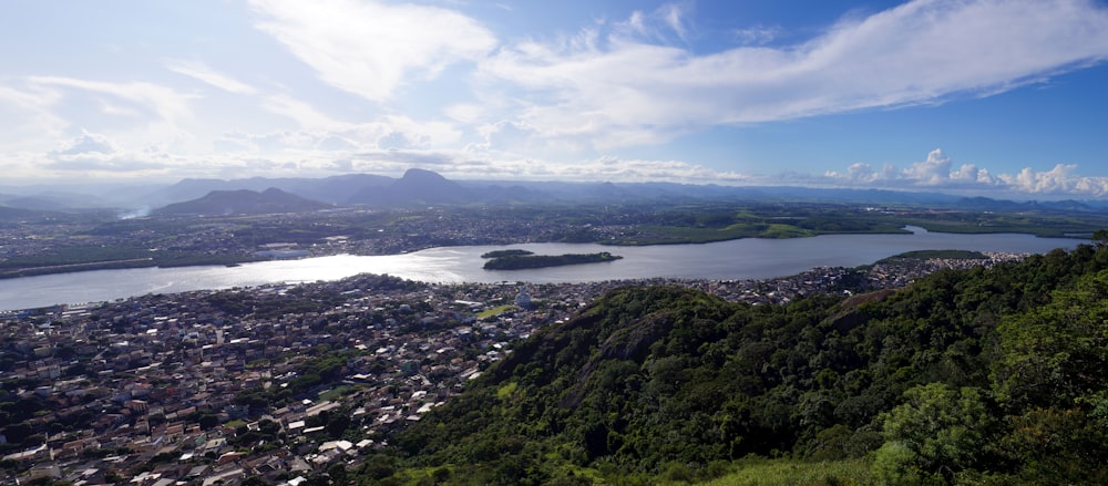 an aerial view of a city and a lake