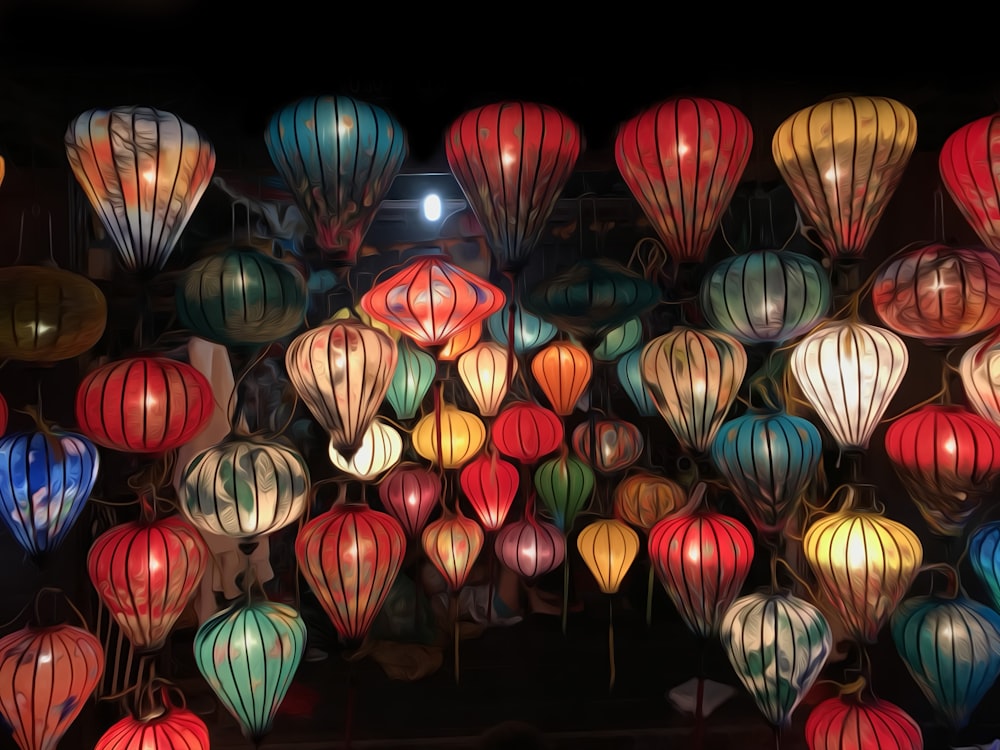a bunch of colorful lanterns hanging from the ceiling