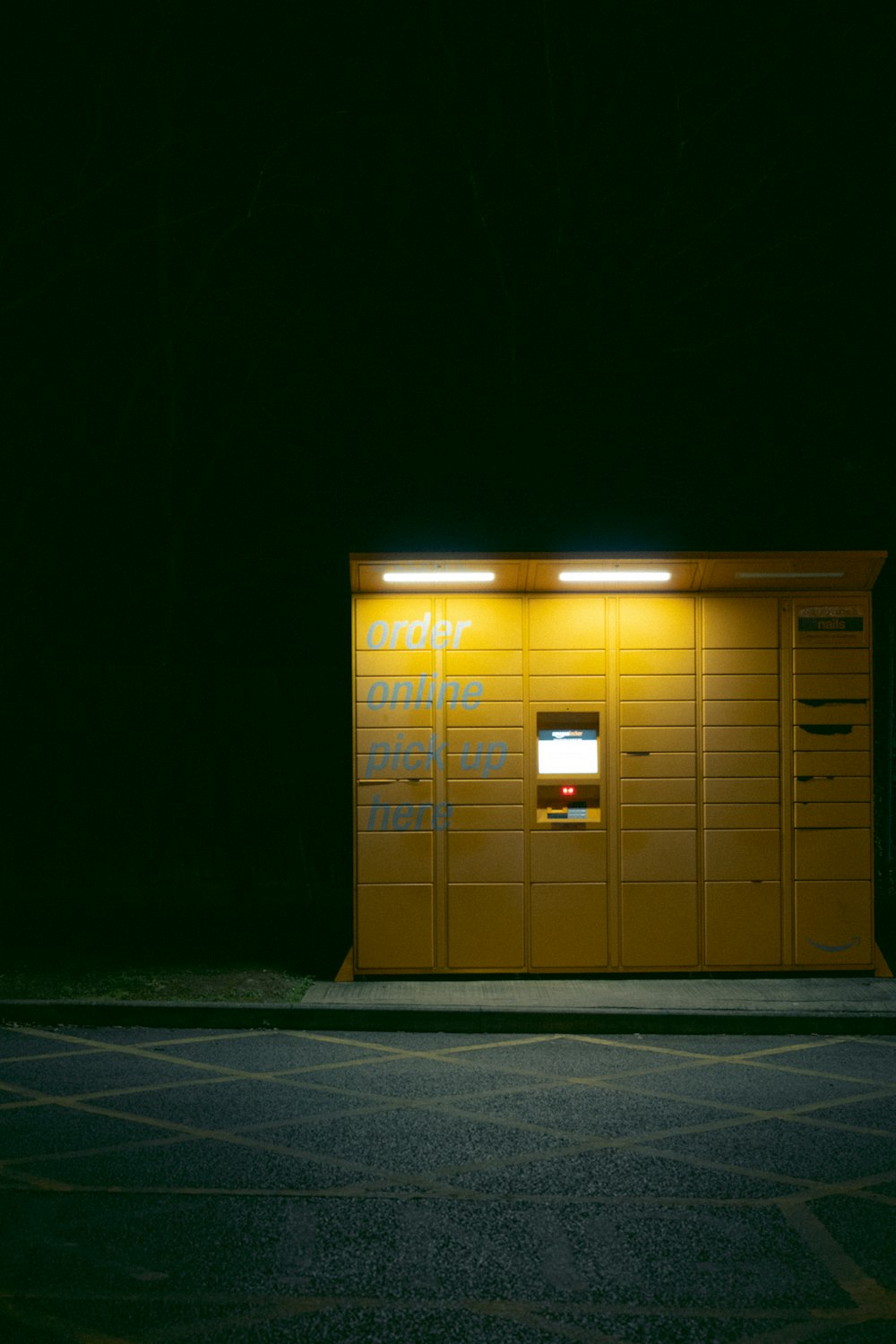 a parking meter sitting in front of a yellow building