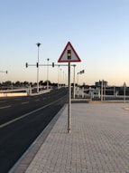 a street sign sitting on the side of a road