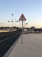 a street sign sitting on the side of a road