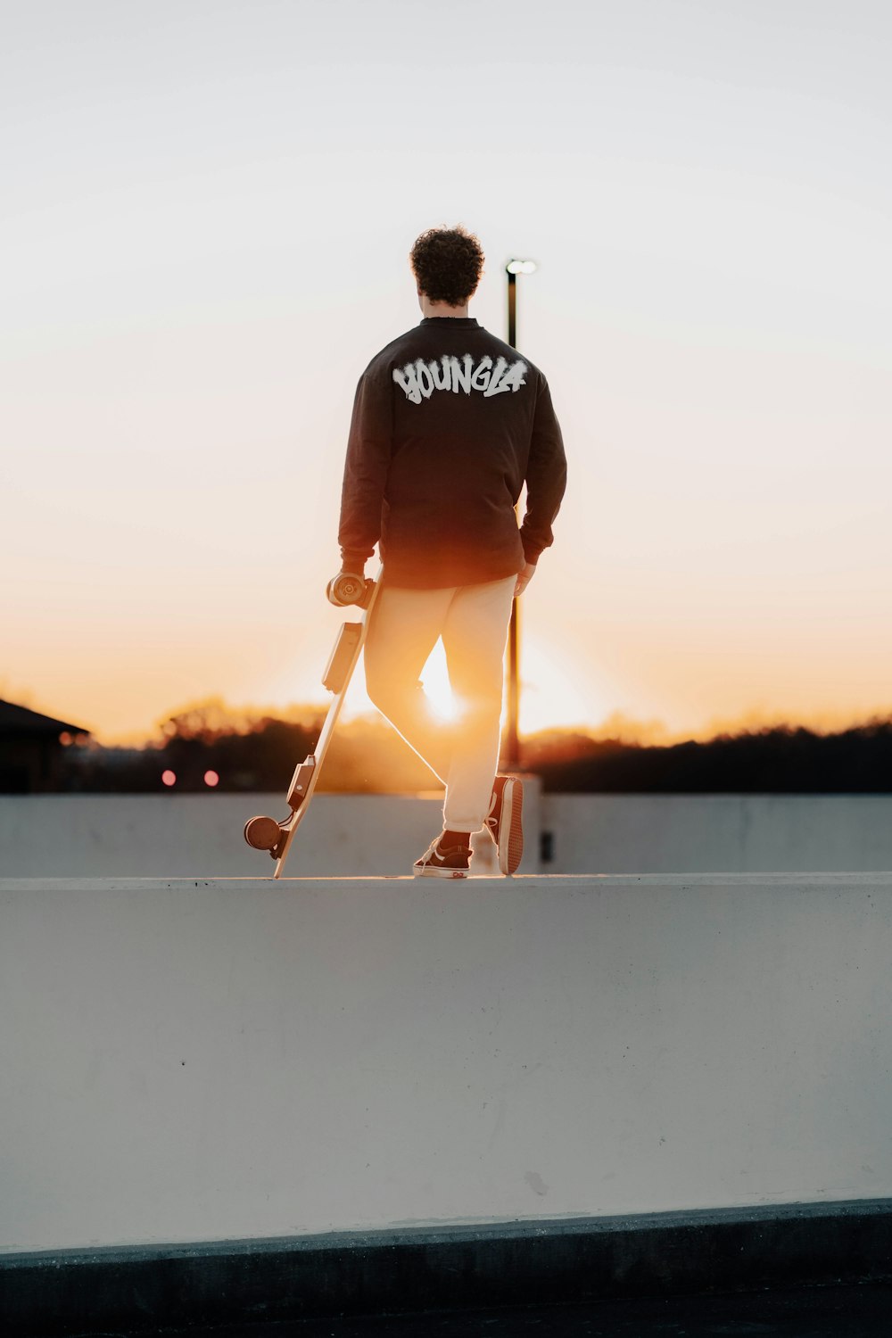 a skateboarder is standing on the edge of a ramp