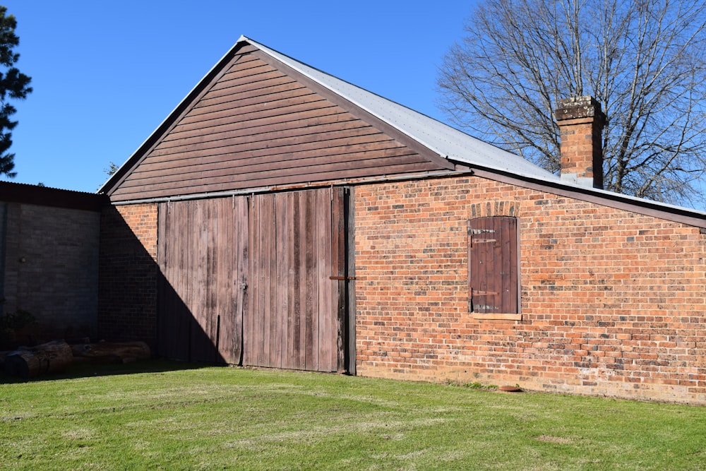 a brick building with a wooden door and window